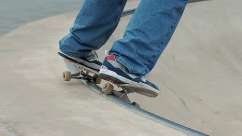 Young Skater Making 360 Flip Jump Performing Kickflip Trick Skateboarder Training in Skatepark