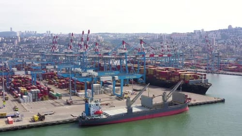 Container Ship docked at port during, Aerial view.