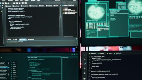 Close Up of Code Running on Computer Displays in Empty Apartment Used By Hacker