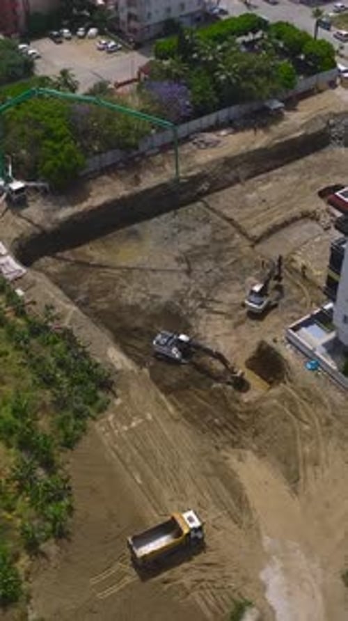 Aerial View of Construction Site with Heavy Machinery