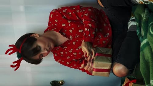 Woman Wrapping Presents at Christmas Time