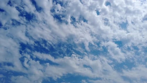 Clouds Drifting Across Vibrant Blue Sky