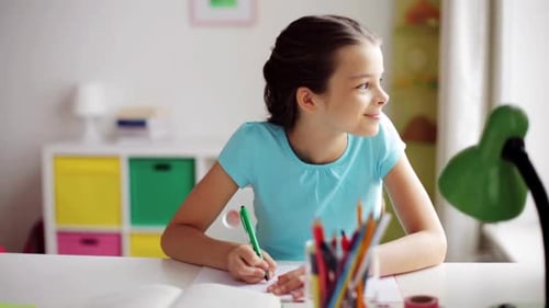 Girl Writing at Desk in Bright Room