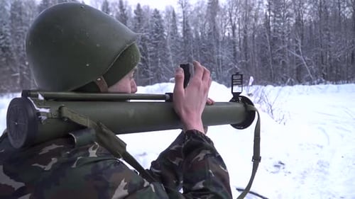 Soldier Aiming with Rocket Launcher in Winter Forest