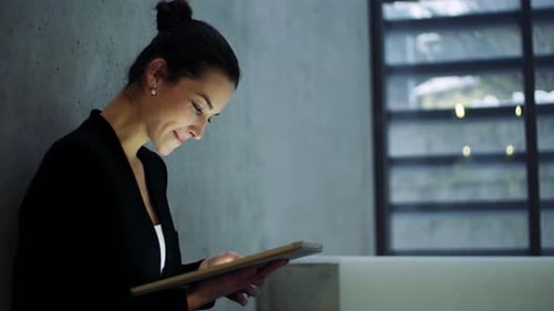 Young Business Woman with Tablet Standing in Office Working