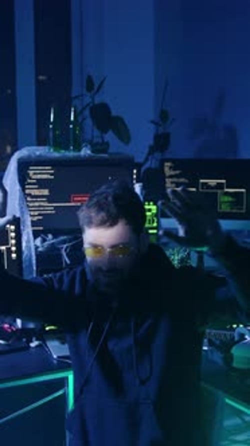 Dark Haired Man Coding at Night