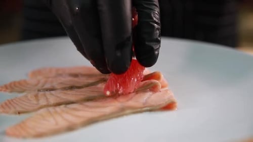 Chef Preparing Salmon and Grapefruit Dish