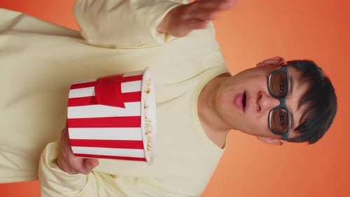 Excited Man With Popcorn Cheers Vertical