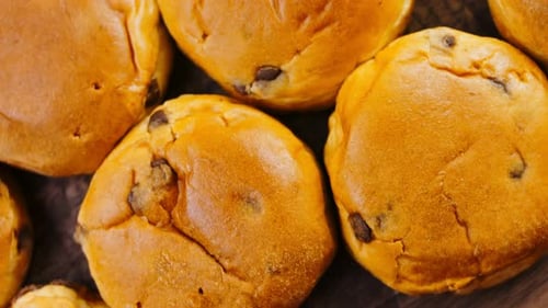 Fresh Chocolate Chip Rolls on Wooden Surface