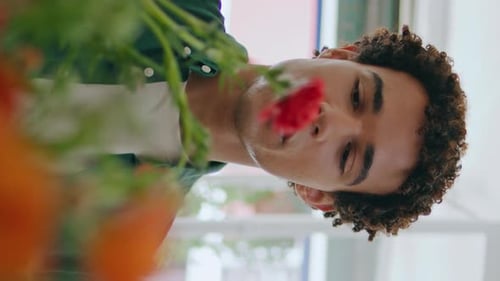African Guy Smell Flower Composition in Store Vertical Happy Man Choose Bouquet