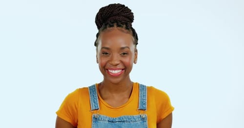 Portrait, funny and humor with a black woman in studio on a blue background laughing at a joke