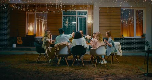 Friends and Family Gather Outside at Night