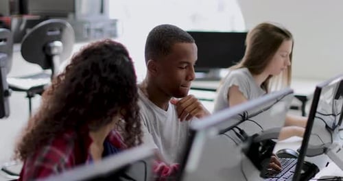 Students learning how to code in class