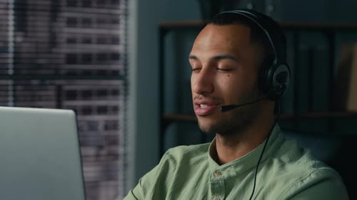 African American Man Manager Call Center Worker Communicate with Client Using Headset Young