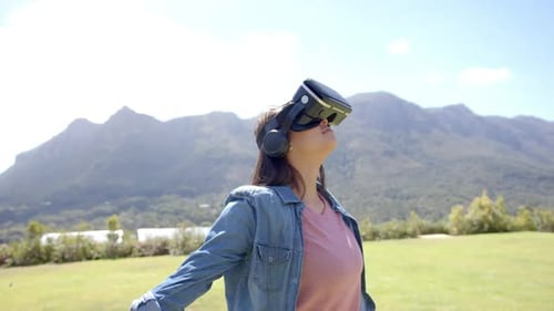 Woman Using Virtual Reality Headset Outside in Nature