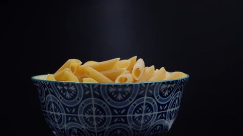 Background of Raw Noodles Rotate on a Black Background