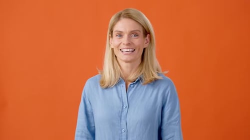 Smiling Woman Gives Approval With Ok Hand Gesture