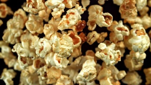 Popcorn Flying and Floating on a Black Background