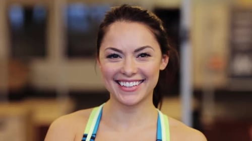 Sport, Fitness, Emotion, Expression And People Concept - Happy Smiling Young Woman At Gym