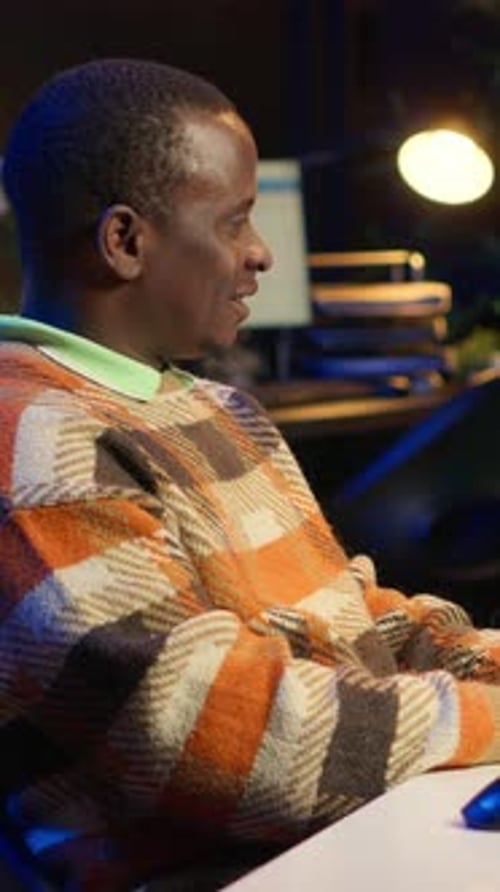 Vertical Video African American Computer Scientist in Home Office Programming Code on Pc