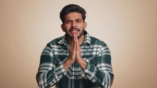 Young Man Pleading and Expressing Frustration