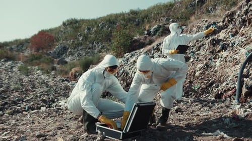 Conducting a Field Investigation in Protective Gear at a Contaminated Environmental Site