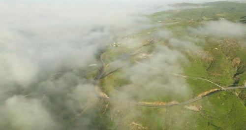 Top down view of curves of coastal road. Highway.