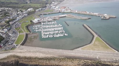 Aerial Drone View of Scenic Coastal Harbor and Seaside Town