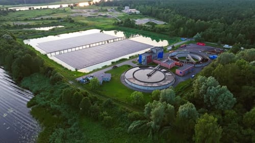 Water Treatment Facility With Floating Solar Park Near Lielupe River Sunset