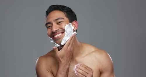 Man Applying Shaving Cream to His Face