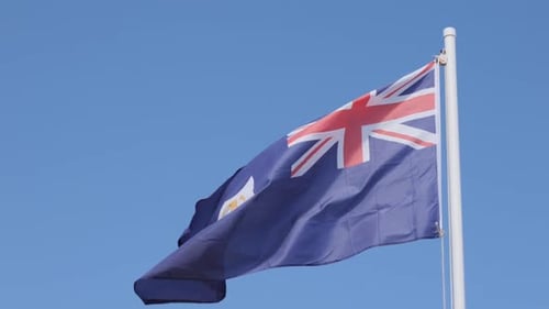 Anguilla Flag Waving Proudly Against a Blue Sky