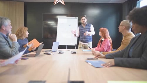 Team Applauds Business Presentation in Modern Office