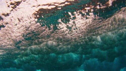 Underwater view of the breaking wave