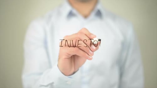 Investors Man Writing on Transparent Screen