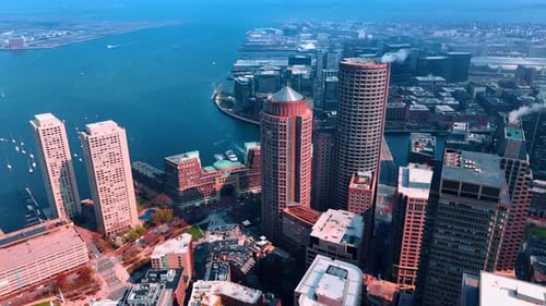 Approaching beautiful skyscrapers in the harbor of Boston.