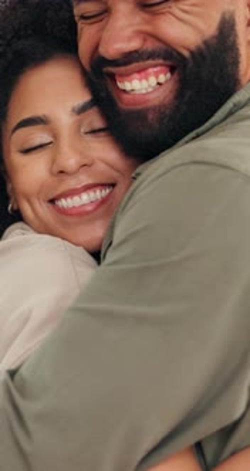 Loving Couple Embracing at Home with Joy