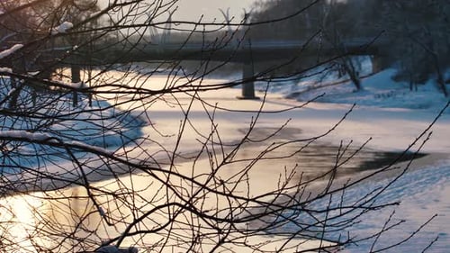 Frozen river winter view at sunset