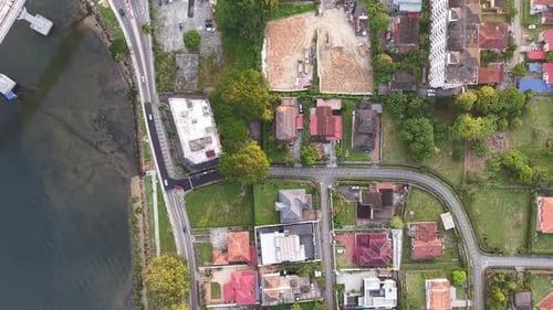 Johor Bahru residential area with houses and a body of water in the background