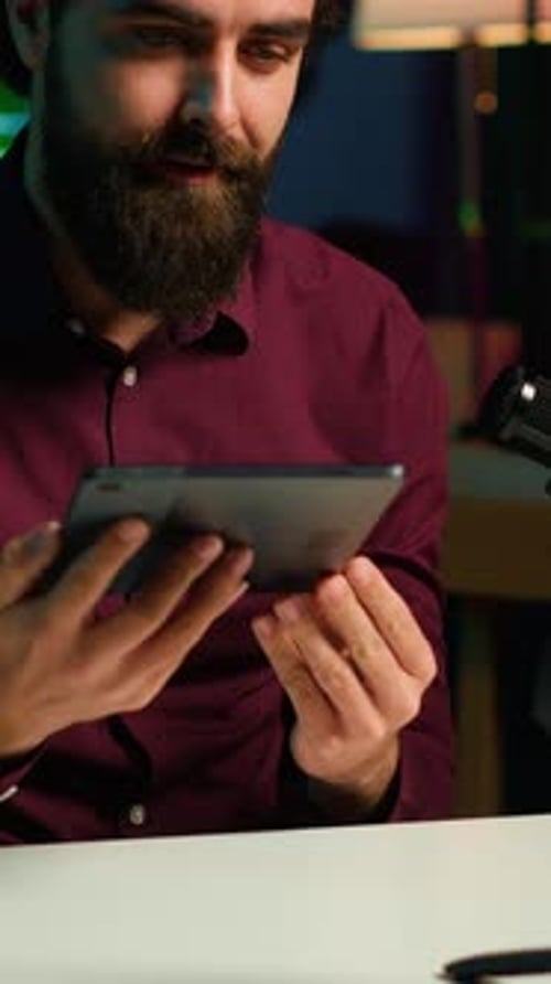 Man with Tablet in a Home Studio