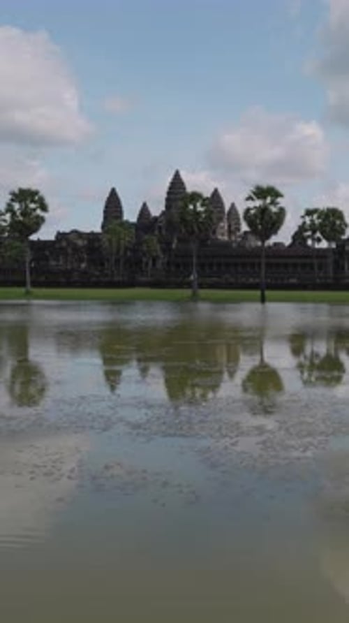 Vertical Slide Left Across Pond Toward Angkor Wat, Siem Reap