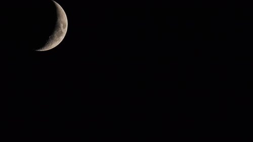 Crescent Moon Moving in Night Sky