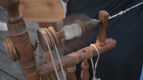 Vintage Wooden Spinning Wheel at Daytime