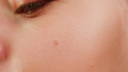 Beauty Shot of Woman Makeup Artist Applying Foundation Bb Cream on Previously Applied Moisturizing