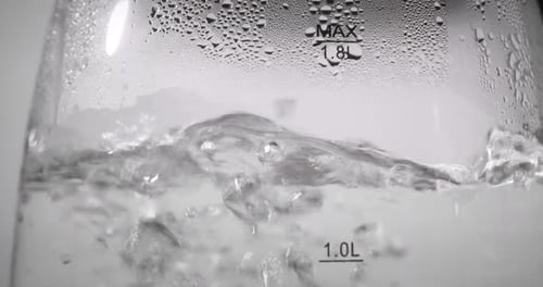 Close Up of Water Boiling in Kettle