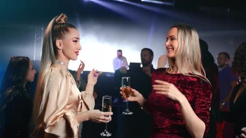 Women Dancing and Celebrating at Nightclub Party