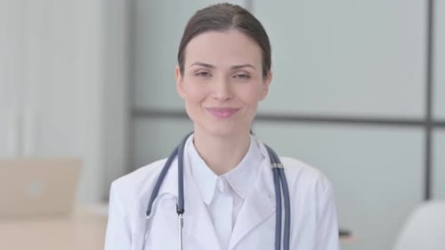 Friendly Doctor Smiling in Hospital Setting