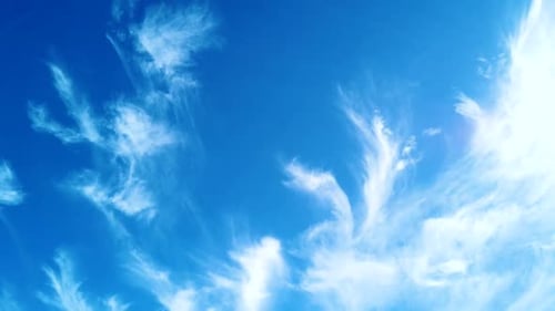 Blue Sky with Drifting White Clouds