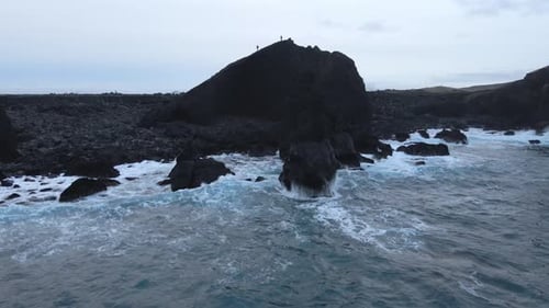 Aerial Seascape South Coast of Iceland. Waves Crashing to Black Rocks on Shore
