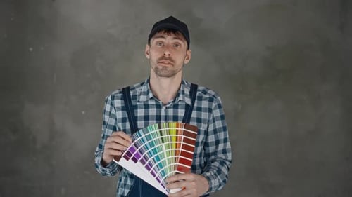 Man Choosing Paint Colors for Home Renovation