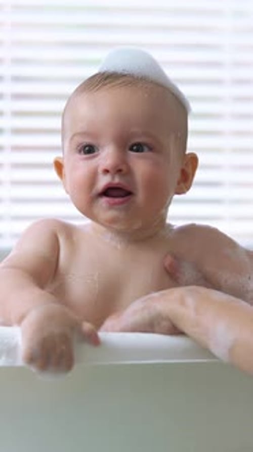 Smiling Baby Taking a Bubble Bath